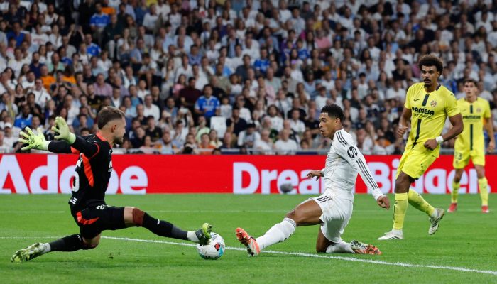 O goleiro Arnau Tenas e Jude Bellingham em lance Real Madrid  x   Villareal
             -       
        Oscar Del Pozo - 4.out.25/AFP